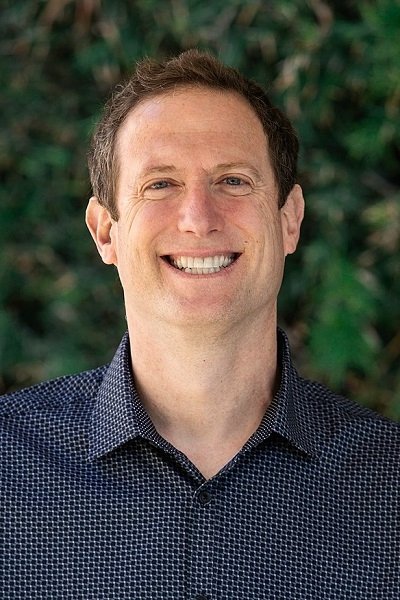 A headshot of Craig Alpert.