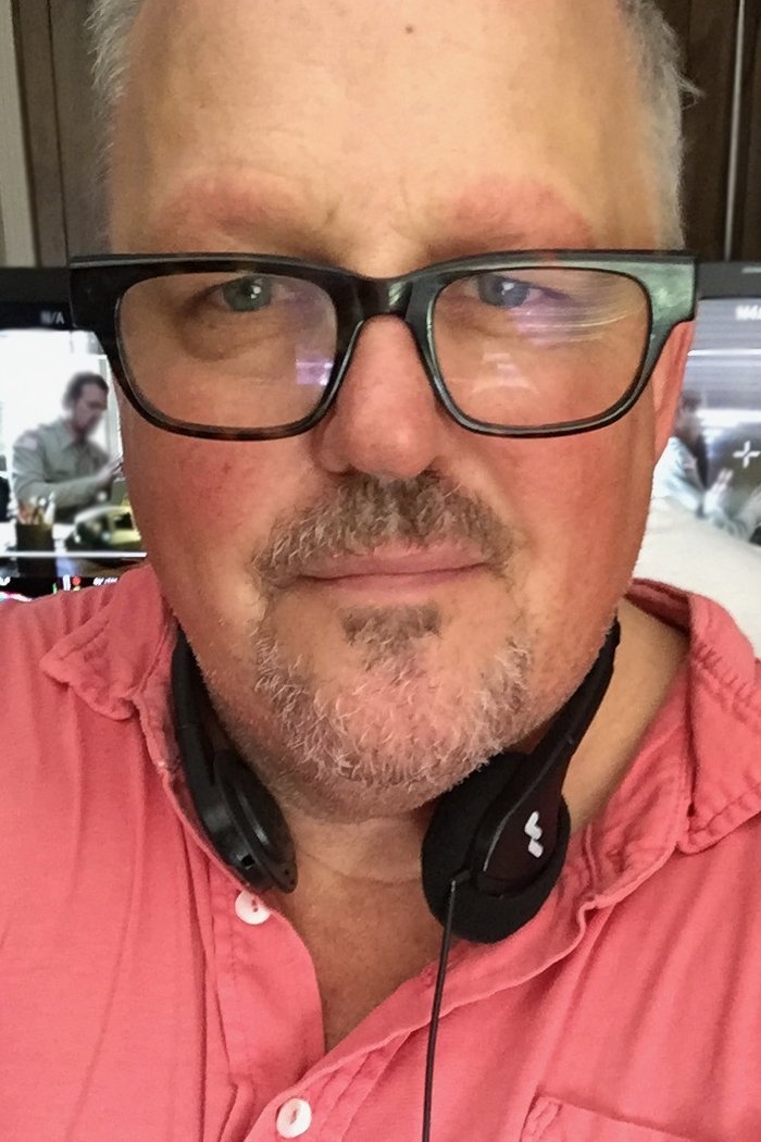 A headshot of Tim Ives.