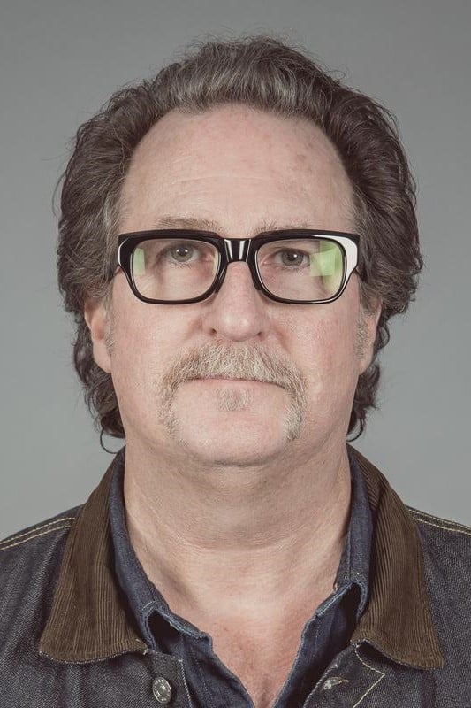 A headshot of John Papsidera.