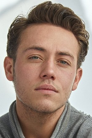 A headshot of Ethan Cutkosky.