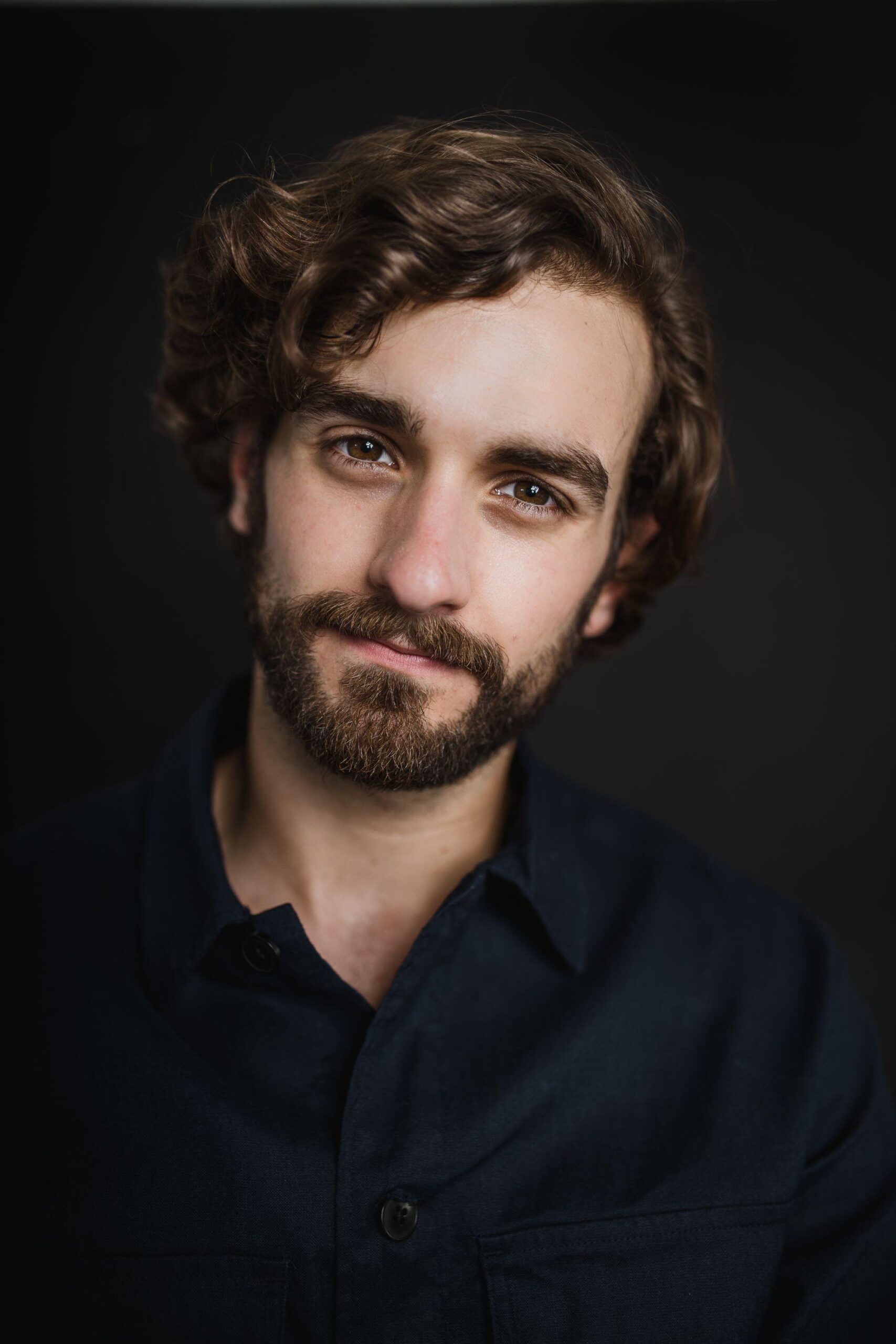 A headshot of Evan Hengst.