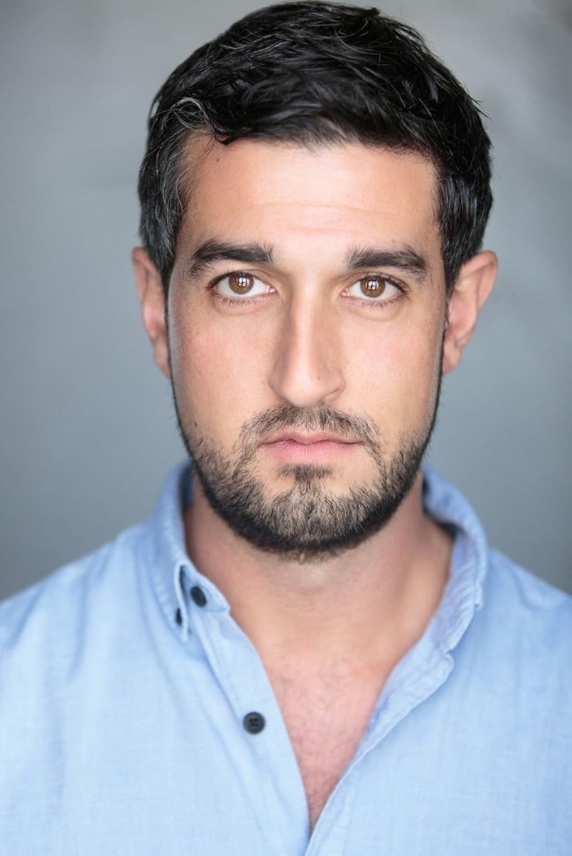 A headshot of Beruce Khan.