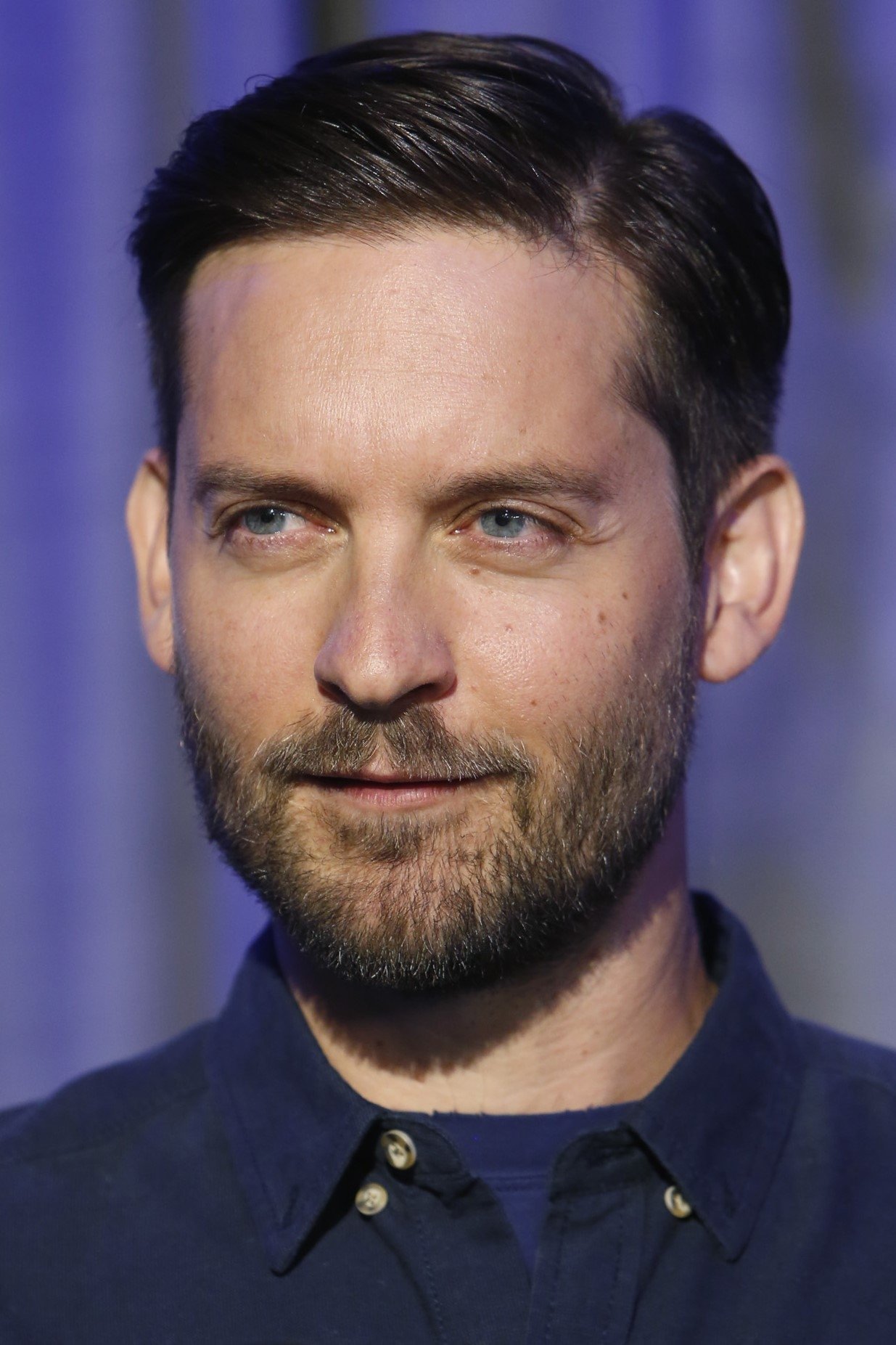 A headshot of Tobey Maguire.