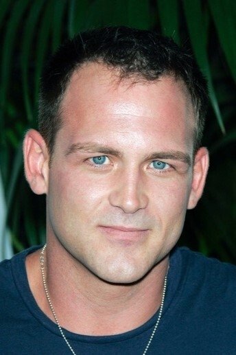 A headshot of Ty Olsson.