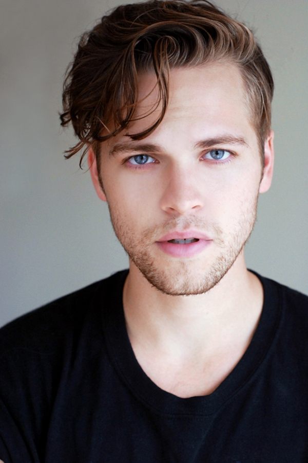 A headshot of Alexander Calvert.