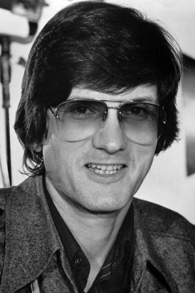 A headshot of John Badham.