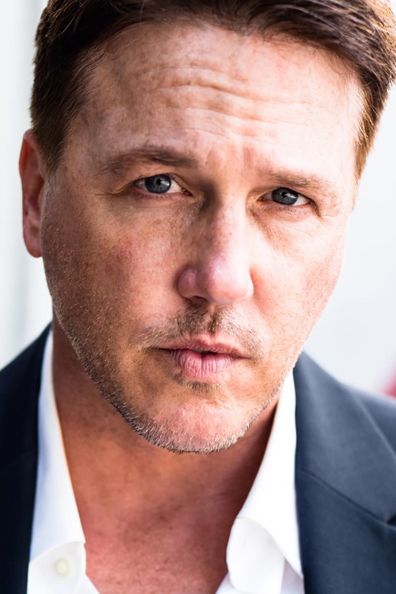 A headshot of Lochlyn Munro.