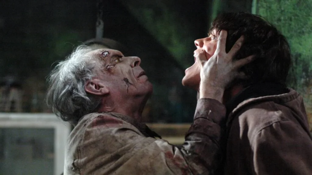 A vengeful, bloody spirit with grey hair and decaying skin grabs Sam Winchester's face inside the abandoned Roosevelt Asylum in Season 1, Episode 10, "Asylum."